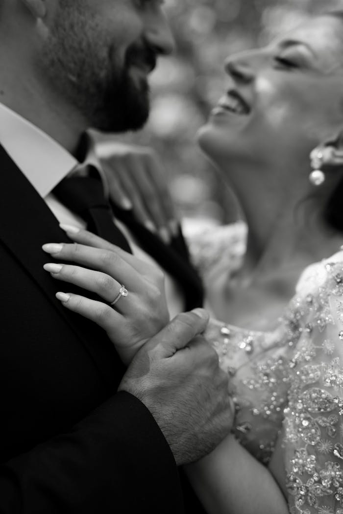 Crafting Captivating Headlines: Your awesome post title goes here A close-up black and white photo of a joyful newlywed couple enjoying their special day.